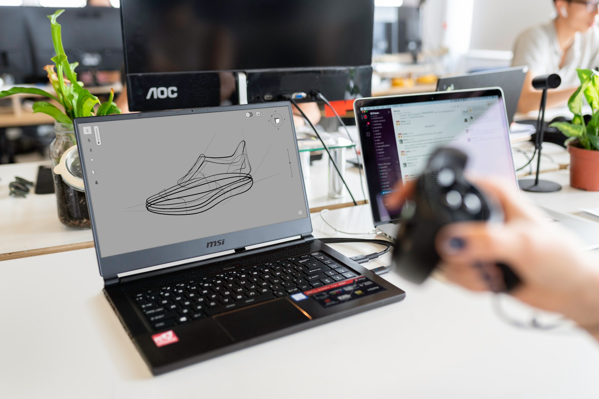 A computer showing product development of a shoe.