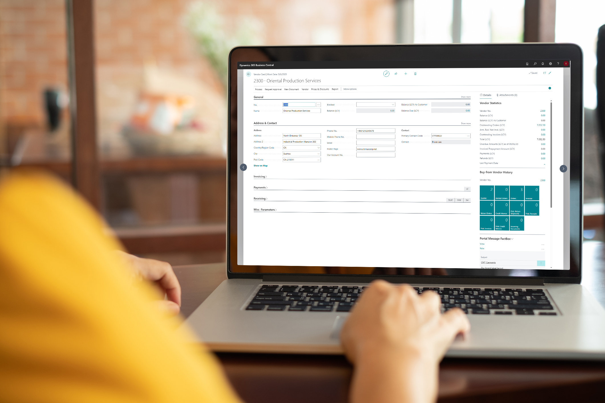 showing a close-up of a computer screen with the TRIMIT Manufacturing dashboard